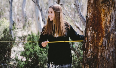 Secondary school student measuring a transect, Kosciuszko National Park. Credit: Remy Brand © Remy Brand/DCCEEW
