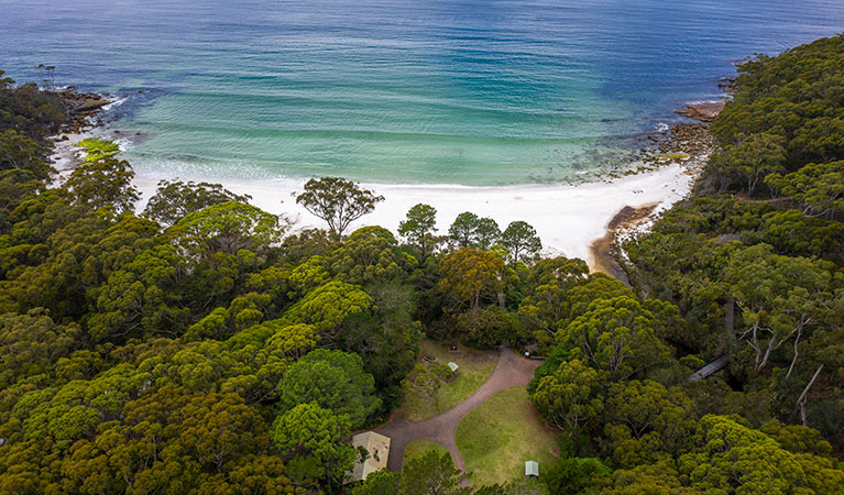 An aerial shot of Greenfield Beach and lawn in Murramarang National Park. Photo: John Spencer &copy; DPIE