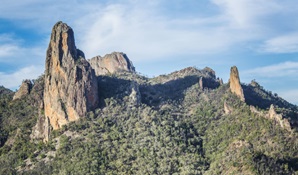 The Breadknife rock formations across the landscape in Warrumbungle National Park. Photo credit: Simone Cottrell © DPIE