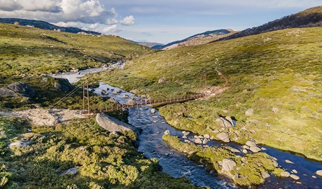 Spencers Creek bridge on Guthega to Charlotte Pass walk, in Kosciuszko National Park. Photo credit: Boen Ferguson &copy; DPIE