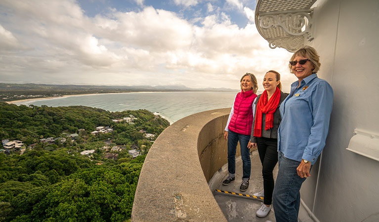 Three women enjoy views from the top of Cape Byron Lighthouse, Walgun Cape Byron State Conservation Area. Photo: John Spencer/OEH.