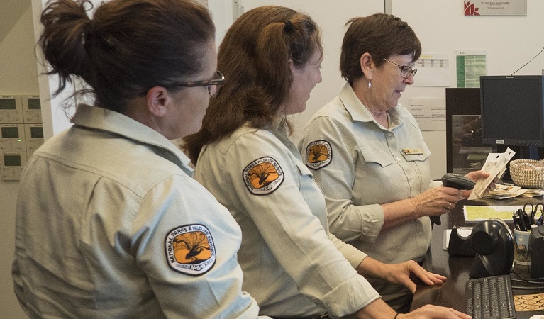 Three NPWS workers at the Warrumbungle Visitor Centre. Photo: Leah Pippos &copy; DPIE